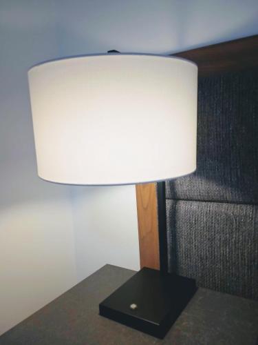 a lamp sitting on a table next to a couch at Winning Post Motor Inn in Mudgee