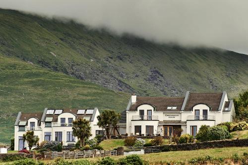 a group of houses in front of a hill at Greenmount House in Dingle