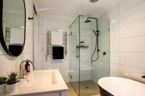 a bathroom with a shower and a sink at Alsace - Healesville in Healesville
