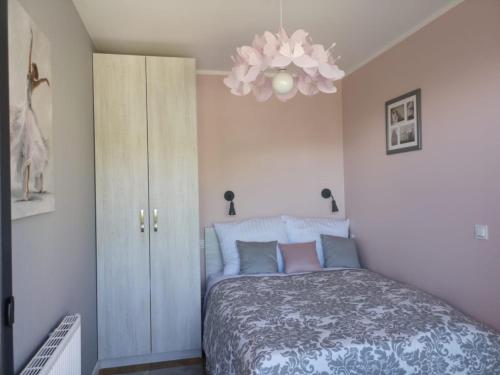 Posteľ alebo postele v izbe v ubytovaní Apartament Malinowy Zakątek Triventi Mountain Residence