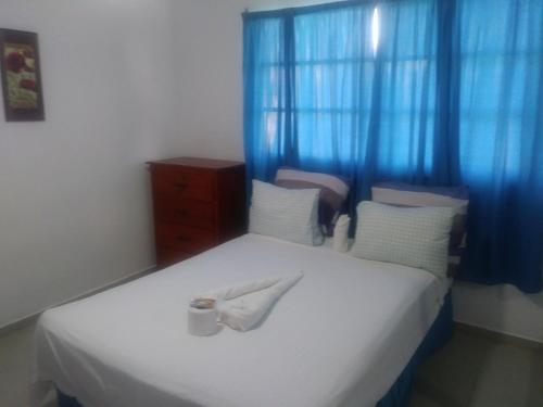En eller flere senge i et værelse på Room with fan use bavaro beach, Punta Cana