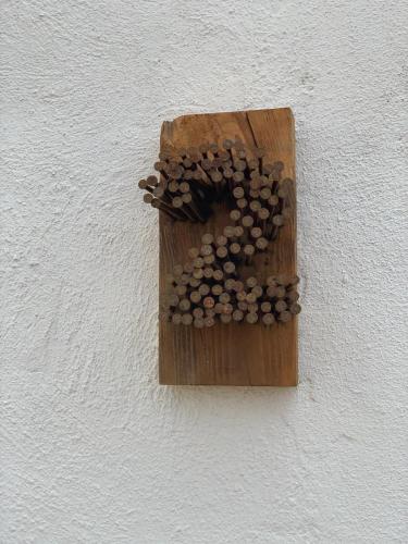 a wooden switch on a wall with mushrooms on it at El Lagar de los Abuelos in Arcos de la Frontera