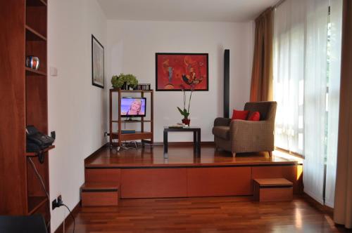 TV a/nebo společenská místnost v ubytování Residence Le Corti