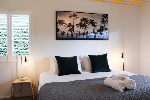 a bedroom with a bed with a stuffed animal on it at 33 - Location location, right amongst it in Wanaka