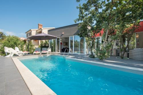 Modern villa Jura with pool near the beach, extra pool heating available