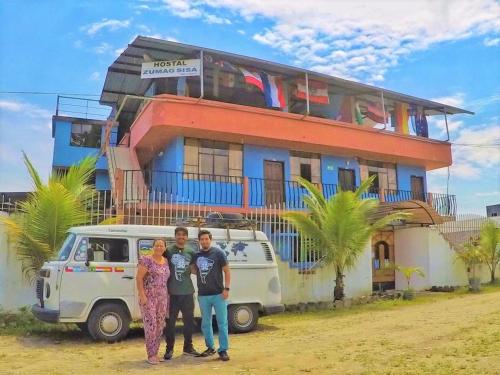 a group of people standing in front of a building at Zumag Sisa in Tena