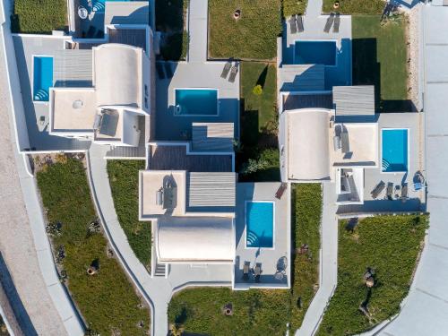 an overhead view of a house with blue roofs at Desiterra Resort in Fira