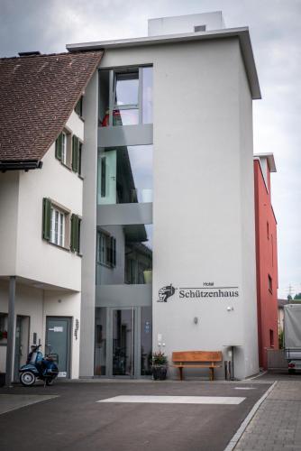 a building with a motorcycle parked in front of it at Hotel Schützenhaus in Uznach