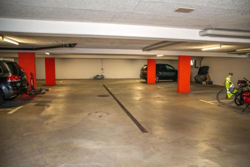 an empty parking garage with cars parked in it at Hotel Schützenhaus in Uznach