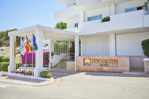a building with a sign in front of it at Hotel Rocamarina - Adults Only in Cala d´Or