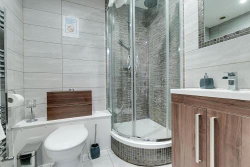 a bathroom with a toilet and a shower at RST Rodney Street in Liverpool