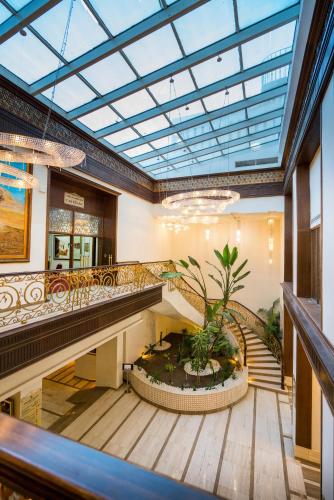 an empty lobby with a large glass ceiling at Sousse Palace Hotel & Spa in Sousse