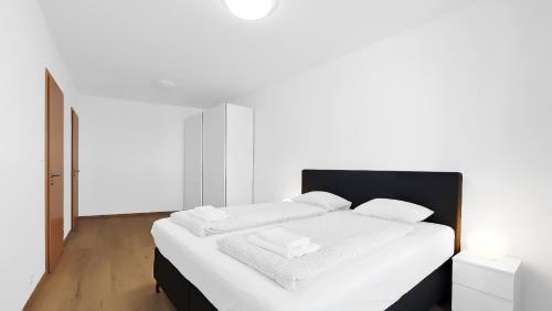 Postel nebo postele na pokoji v ubytování Apartments Krakovska