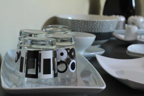 a glass jar on a plate on a table at Giulimà B&B in Rocchetta SantʼAntonio