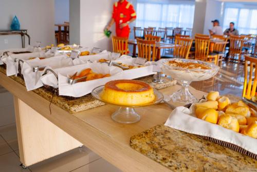 a table with a bunch of food on it at Abba Hotel in Betim