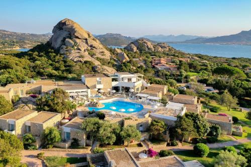 an aerial view of a villa with a swimming pool at Hotel Grand Relais Dei Nuraghi in Baja Sardinia