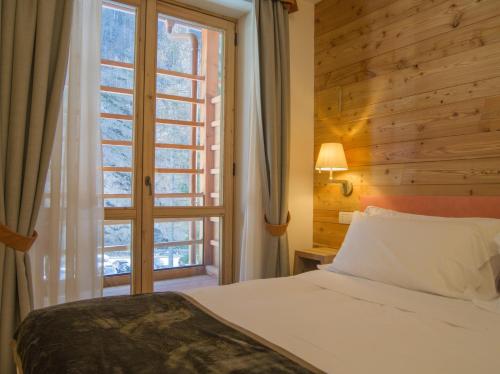 Alagna Mountain Resort & SPAにあるベッド