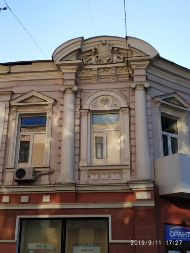 a building with columns on the side of it at Apartments at Kontorska 10 in Kharkiv
