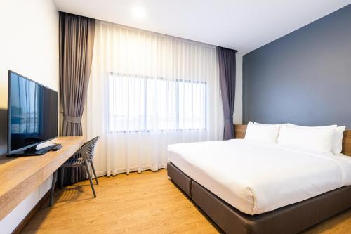 Телевизор и/или развлекательный центр в Icon Park Hotel, Chiang Mai- SHA Extra Plus