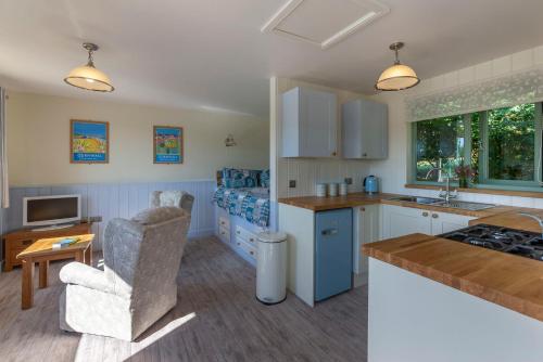 a kitchen with a sink and a counter top at Lynstone Lakes in Bude