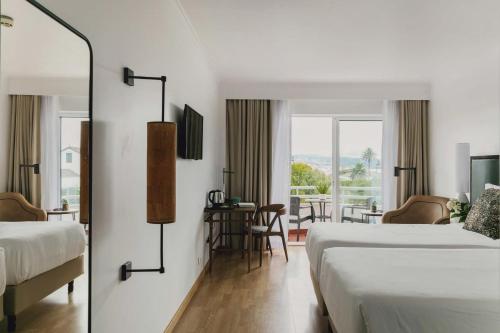 Postel nebo postele na pokoji v ubytování Hotel Ponta Delgada