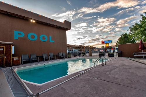 a swimming pool in front of a hotel at Big Horn Lodge in Moab