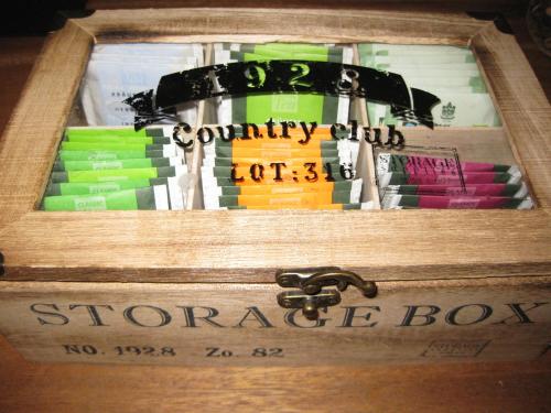 a wooden box filled with different colored books at Apartment Central Leipzig - City in Leipzig
