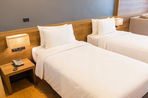 Кровать или кровати в номере Icon Park Hotel, Chiang Mai- SHA Extra Plus