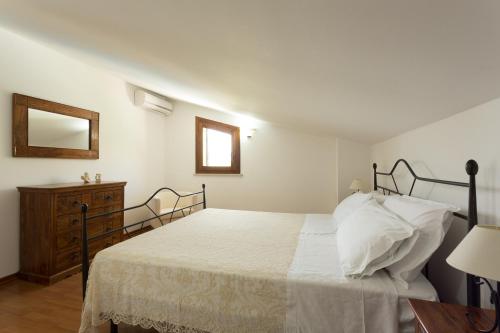 Säng eller sängar i ett rum på Villa Calaforno