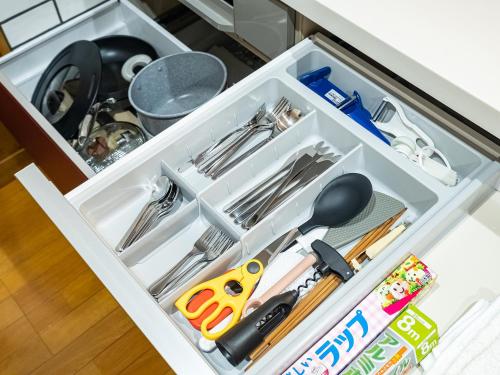 a drawer filled with utensils in a kitchen at Villa Ensoleille in Fujikawaguchiko