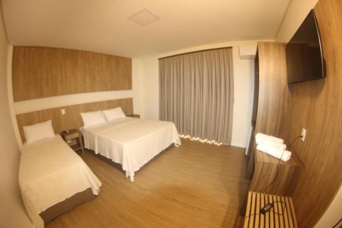 Krevet ili kreveti u jedinici u objektu Ouro Minas Plaza Hotel