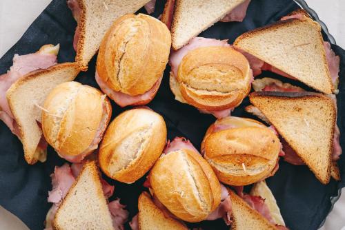 a pile of sandwiches on a plate at Hotel T Depandance in Rimini