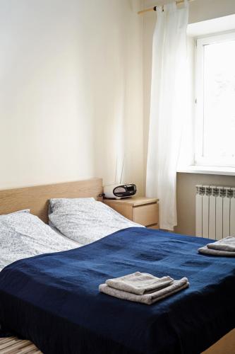 Katil atau katil-katil dalam bilik di Marszałkowska Apartment