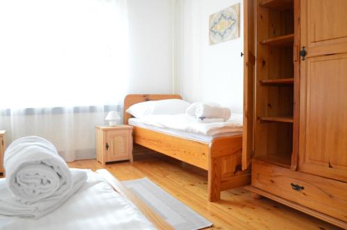 a small bedroom with a bed and a closet at Apartmány LÍVIA Litmanová in Litmanová