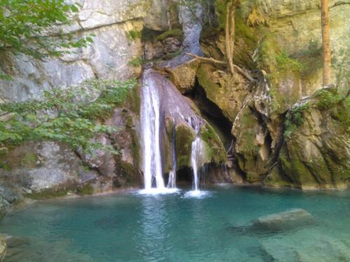 a waterfall in a pool of water at Lezegorria in Urzainqui