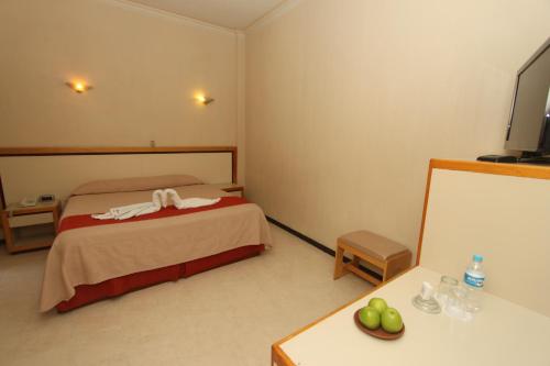 Кровать или кровати в номере HOTEL FERRI