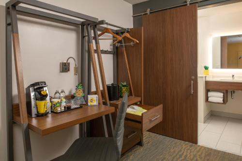 a bathroom with a shower and a desk and a sink at Staypineapple, Hotel Z, Gaslamp San Diego in San Diego