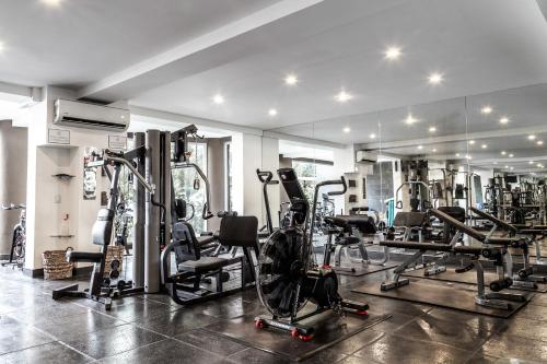 a gym with several treadmills and exercise bikes at Los Altos Resort in Manuel Antonio