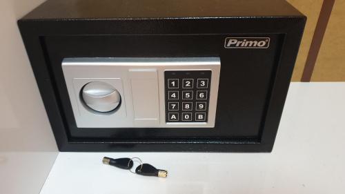 a black and white microwave with a remote control at Perfect Suites in Neos Marmaras