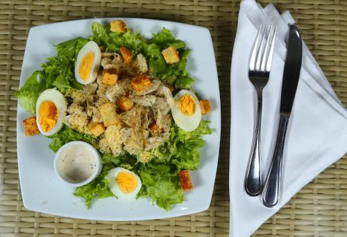 a plate with a salad with eggs on it at Hotel Cabreromar in Cartagena de Indias