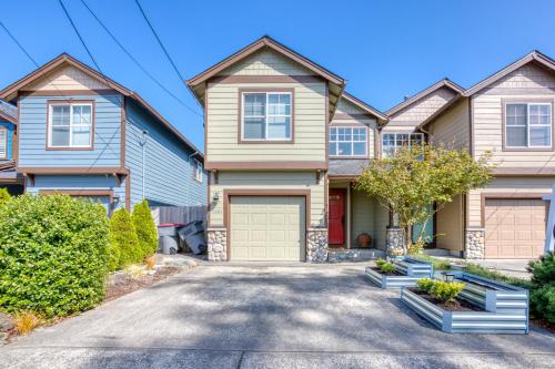 a house with a driveway in front of it at Seaside Upscale Townhome in Seaside