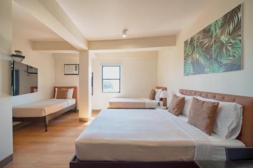 Postel nebo postele na pokoji v ubytování Achievers Airport Hotel
