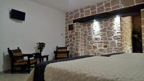 Posteľ alebo postele v izbe v ubytovaní Casa de Cactus