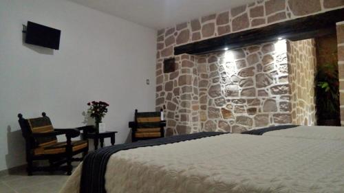 Postel nebo postele na pokoji v ubytování Casa de Cactus