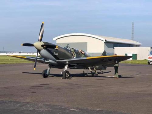 a small propeller plane sitting on a runway at The Waters Edge in Lee-on-the-Solent