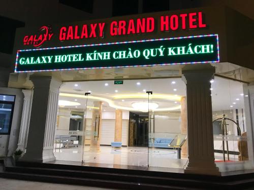 a gala grand hotel with a sign on the front of it at Galaxy Grand Hotel in Sơn La