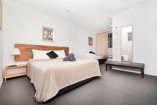 Ein Bett oder Betten in einem Zimmer der Unterkunft Bald Hills Motel