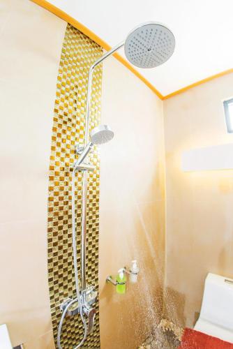 a shower in a bathroom with a glass door at ลอฟท์แอทสีมา สาขา2 in Nakhon Ratchasima