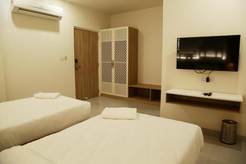 Postel nebo postele na pokoji v ubytování Hotel Ratangarh Palace