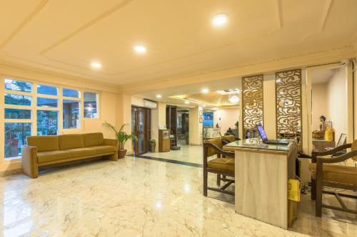 an office lobby with a reception desk and a couch at Hotel Moonlight in Kathmandu